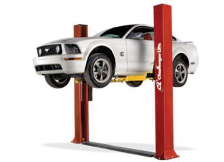 9,000 floor plated 2-post lift holding a Ford Mustang