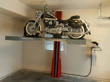 Load image into Gallery viewer, Advantages single-post vehicle lift creating space by lifting a motorcycle in a home garage
