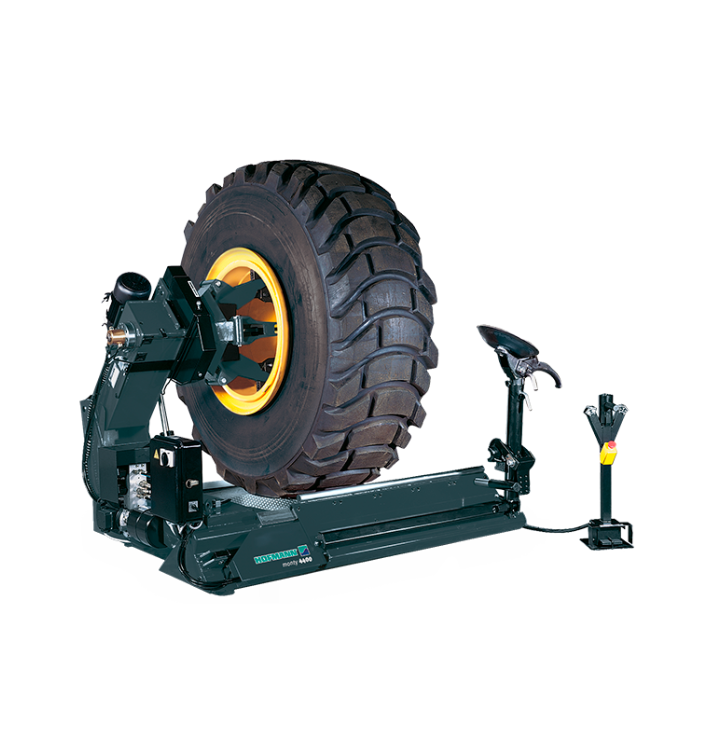 Hofmann Monty 4400 heavy-duty truck wheel changer with sturdy arms and mechanical components for tire mounting and dismounting.