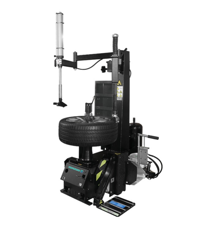 Hofmann Monty 8200S center-post tire changer with wheel mounting arm and control panel, used for automotive tire installation.